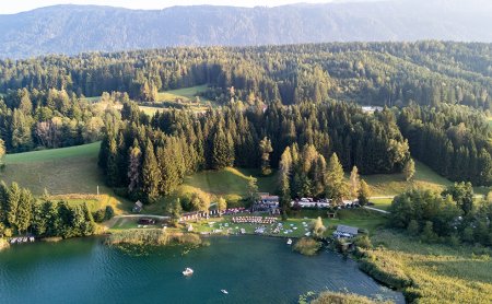 Aerial view of lake, beach area and forest