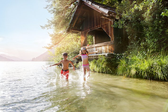Kids splashing happily at the lake shore