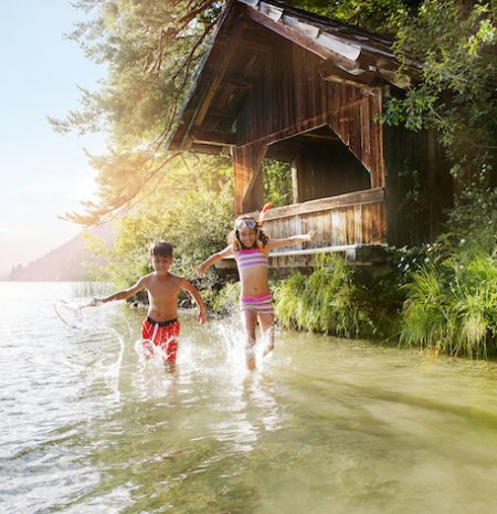 Kids splashing happily at the lake shore